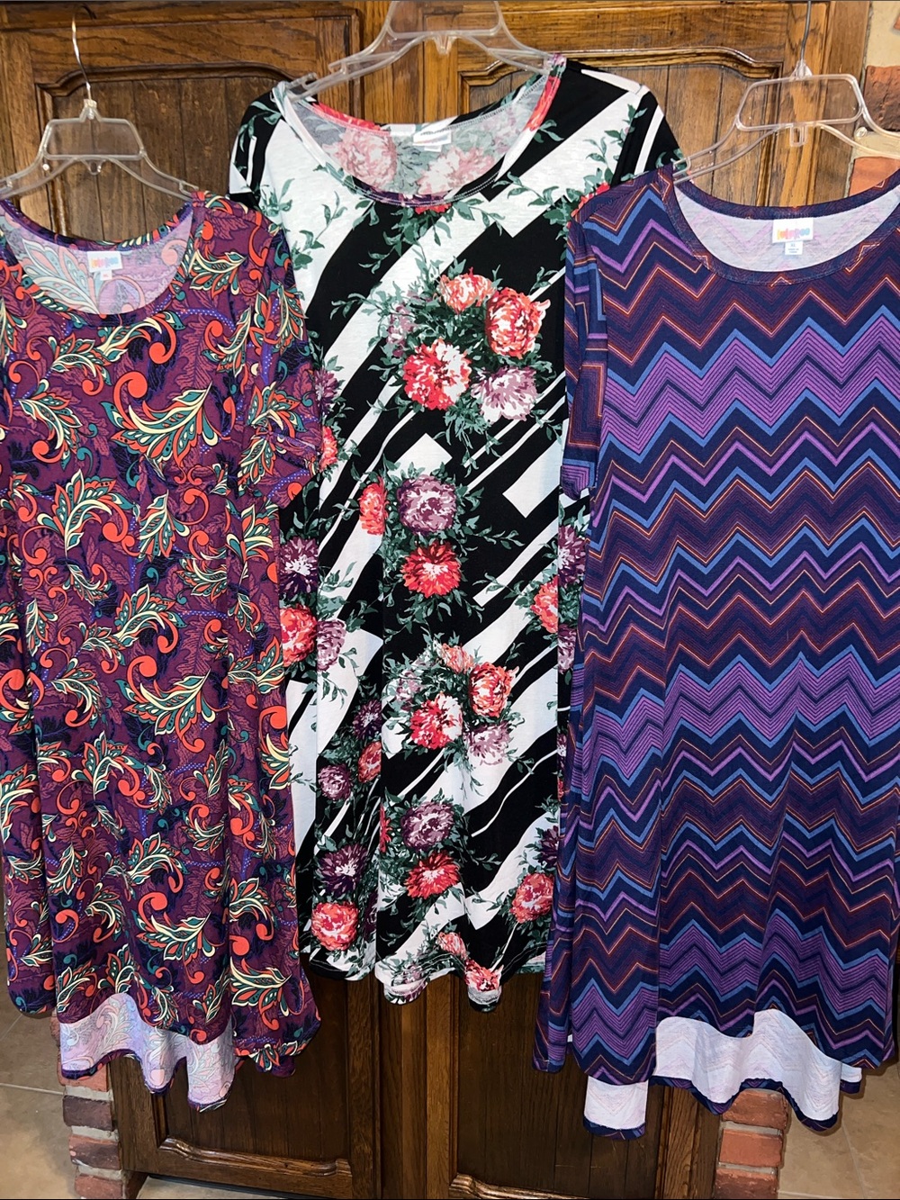 Lularoe 3 Dresses 2 Carly’s and one with pockets
